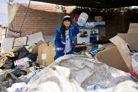 Isabel Quilichi Rebollar, one of the Resource Entrepreneurs organizing the plastic that she has collected at the collection center.