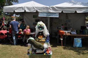 Mother Earth with baby.  Local students are invited to participate in an annual sculpture contest made with used and recyclable materials to illustrate the importance and value in reuse. 