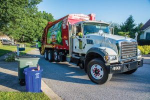 Penn Waste residential garbage truck collecting on a route.